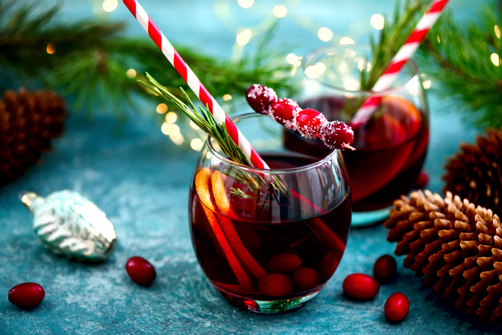 Christmas punch on a winter table, front view, festive warming